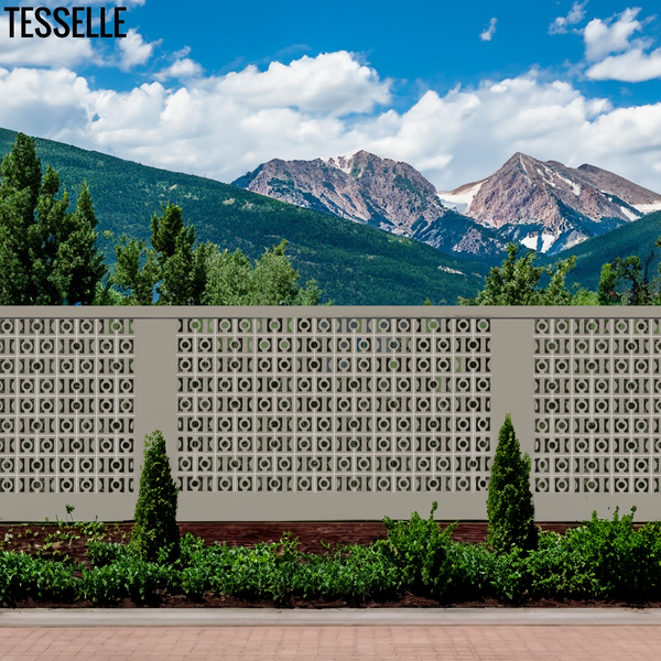 Decorative High Beam Low Beam Breeze Blocks wall with geometric pattern in front of a mountain range