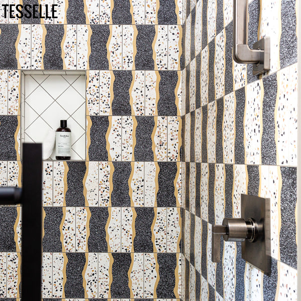https://tesselle.com/collections/shoreline-cement-tiles/products/shoreline-rockport-8-square-terrazzo-cement-tile in a shower