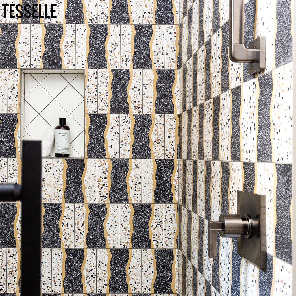 https://tesselle.com/collections/shoreline-cement-tiles/products/shoreline-rockport-8-square-terrazzo-cement-tile in a shower