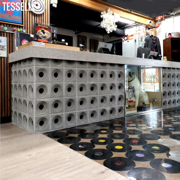 Crater Grey Breeze Blocks at a Vinyl Record Store Counter